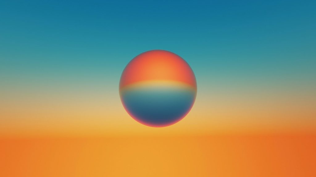 multicolored-sphere-against-sunset-like-sky.jpeg